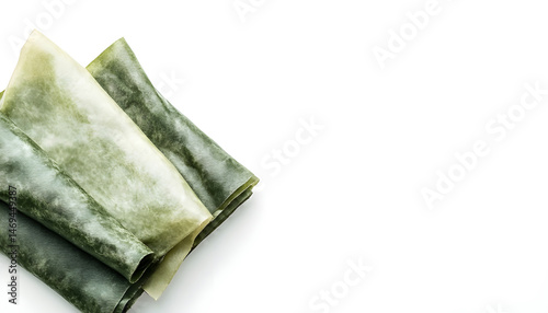 Obraz na płótnie Green beeswax food wraps on white background, top view. Banner design w salonie