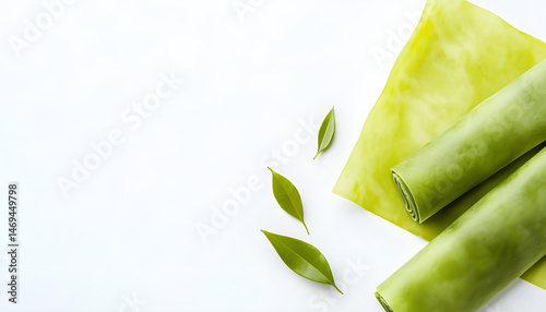 Obraz na płótnie Green beeswax food wraps on white background, top view. Banner design w salonie