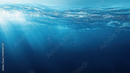Underwater View of Ocean with Light Rays and Bubbles