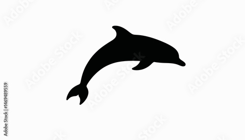 Graceful dolphin leaping in silhouette, ocean freedom