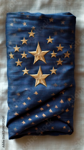 Folded historical flag with embroidered stars