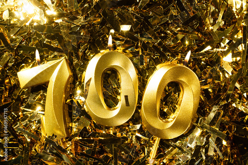 700 followers or subscribers, card golden birthday candle gold tinsel background. blogs celebration. Seven hundred fans.