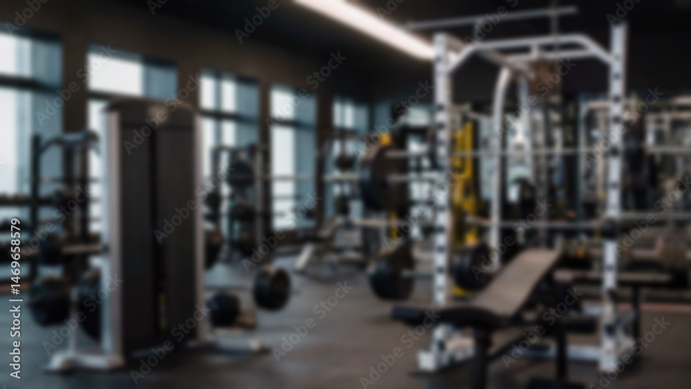 Fototapeta premium Abstract blurred fitness center with equipment as background, modern theme with complete equipment, bright light, blurred gym background.