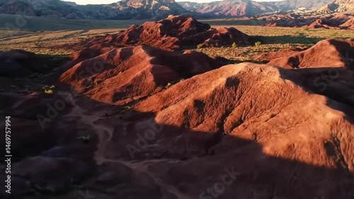 Vast Arid Landscape with Dunes and Rock Formations at Dawn