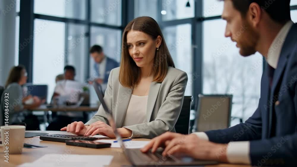 Smiling woman engaged in collaborative work with colleagues in a modern office setting during a busy weekday meeting Smiling woman engaged in collaborative work with colleagues in a modern office setting during a busy weekday meeting