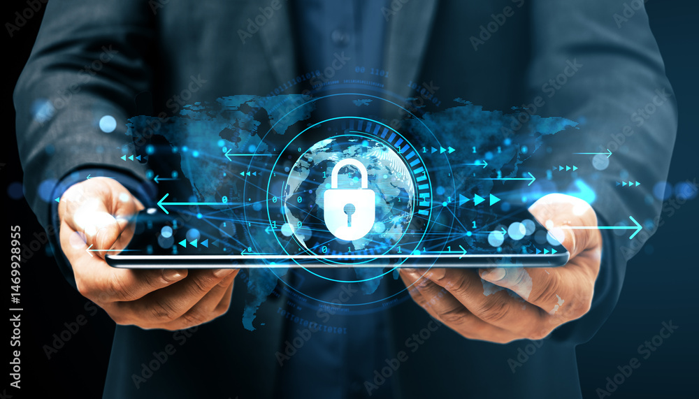 Fototapeta premium Businessman holding digital tablet with glowing cybersecurity lock interface over dark background representing data protection concept.