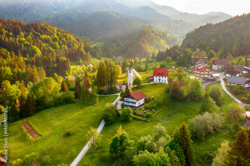 Calm idyllic village in Slovenian mountains at sunrise, summer travel concept
