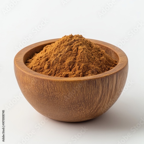 Wooden bowl of cinnamon powder