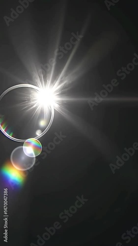 Bright light flares with rainbow prism effect on dark background