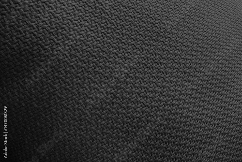Wallpaper Mural close-up shot of a dark black woven fabric, showcasing its detailed texture and pattern, ideal for use as a neutral background in various design projects. Torontodigital.ca