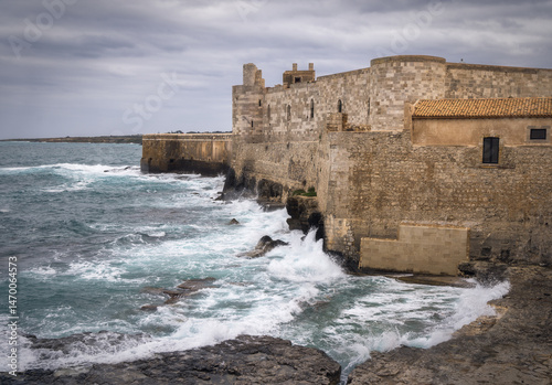 Majestic Ortigia Castle Overlooks Crashing Waves of Sicilian Coast, Italy