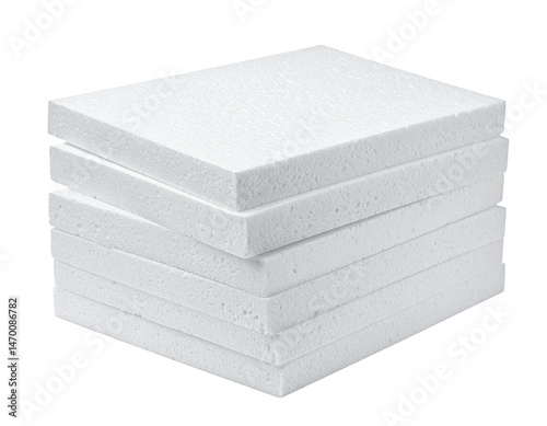 Stack of white foam boards arranged neatly in a pile.