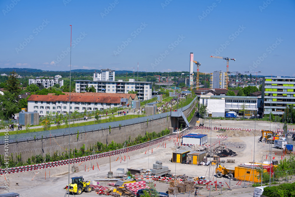 Fototapeta premium High angle view of opening day of park named Überlandpark on top of highway enclosure on a sunny spring Saturday. Photo taken May 10th, 2025, Zurich Schwamendingen, Switzerland.