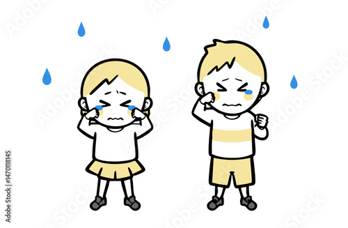 静かに泣く、普段着の男女の子ども