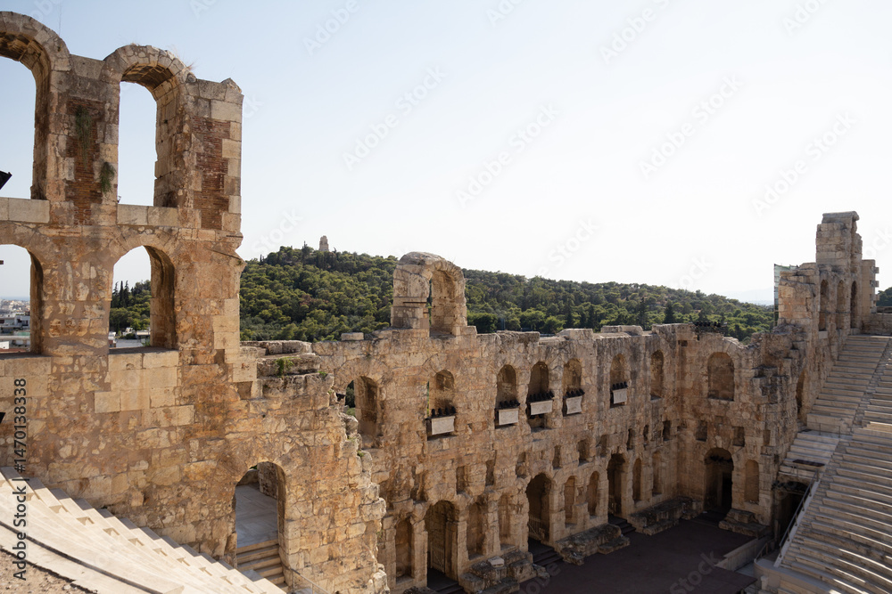 Naklejka premium The ancient stone theatre of the Odeon of Herodes Atticus in Athens, beautifully preserved and still used for performances today.
