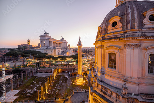 Canvas Print Scenic view of a historic dome and ancient Roman ruins glowing in the sunset light