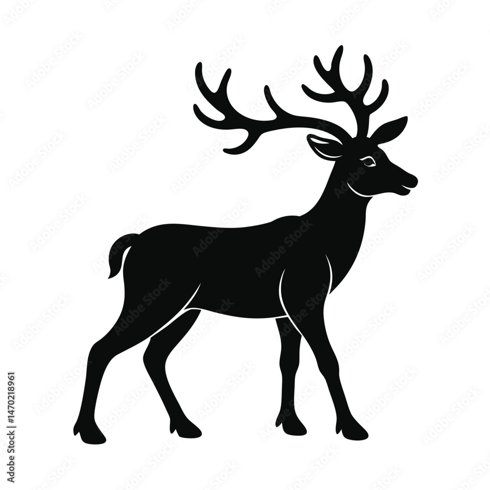 Fototapeta premium Silhouette of a majestic deer walking quietly in a natural habitat during the early morning light