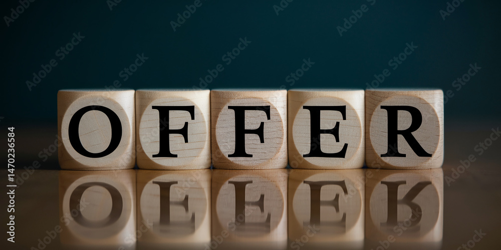 Wooden cubes spelling OFFER reflect on a surface, creating a business or marketing concept image, ideal for showcasing deals or promotions Wooden cubes spelling OFFER reflect on a surface, creating a business or marketing concept image, ideal for showcasing deals or promotions
