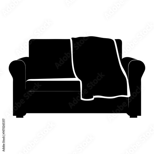 Silhouette of a cozy sofa with a blanket draped over the back