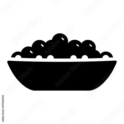 Bowl overflowing with round objects, a culinary abundance in solid silhouette