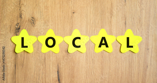 Wallpaper Mural Local symbol. Concept word Local on beautiful yellow paper stars. Beautiful wooden table wooden background. Business lifestyle local concept. Copy space. Torontodigital.ca