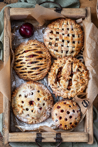 Assorted homemade rustic american style apple and plum pies