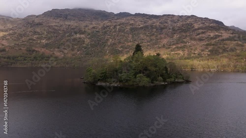Drone orbit around an island on a Scottish Loch
