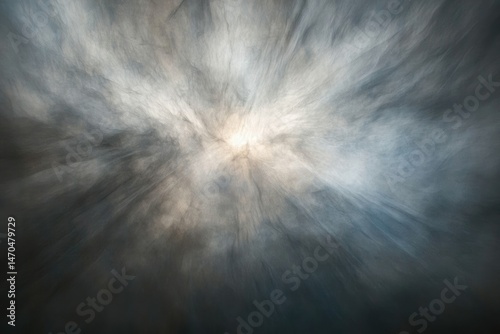 Abstract image depicting a radiant, ethereal burst of light emerging from a swirling, smoky cloud formation.