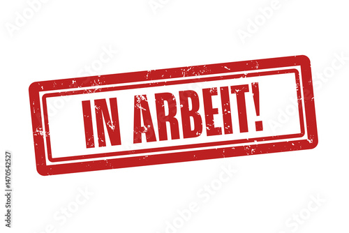 In Arbeit (In progress) - A red stamp, isolated on white background.