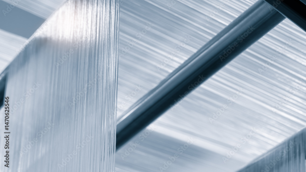 Obraz premium synthetic textile thread, thread at industrial weaving manufacturing machine, textile fabric production industrial concept background