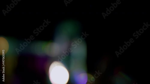 4K Lens flare and bokeh overlay on black background, abstract elegant light effects, transition overlay, high-quality organic footage lightleak, leak, flare for screen mode, optical rays.