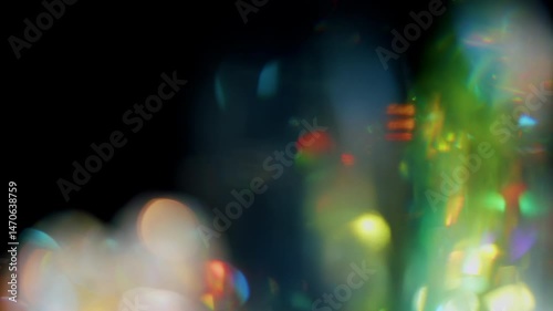 4K Lens flare and bokeh overlay on black background, abstract elegant light effects, transition overlay, high-quality organic footage lightleak, leak, flare for screen mode, optical rays.