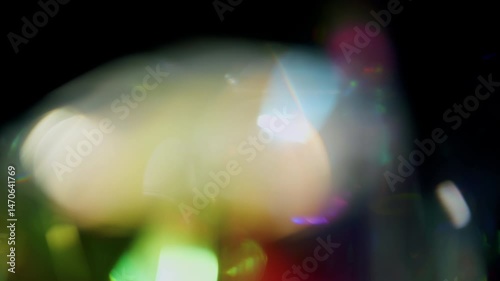 4K Lens flare and bokeh overlay on black background, abstract elegant light effects, transition overlay, high-quality organic footage lightleak, leak, flare for screen mode, optical rays.