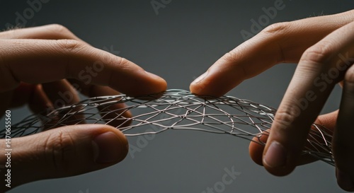 Medical stent held by fingers, photo