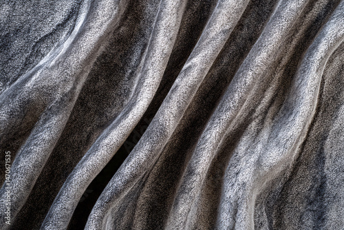 Wallpaper Mural Textured Marble Waves: A close-up view of beautifully textured marble, showcasing flowing, organic waves of gray and white. A captivating abstract design, evoking elegance and natural beauty. Torontodigital.ca