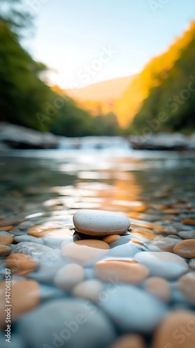 Serene River Scene with Smooth Stones at Sunset