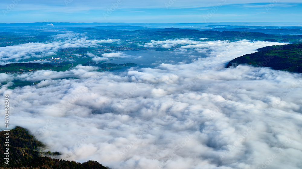 Obraz premium Breathtaking view over a sea of clouds from a high mountain landscape in the morning light showcasing the beauty of nature