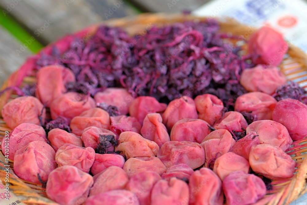 Fototapeta premium pickled plums is drying in the sun 