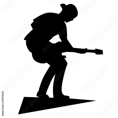 silhouette of a man perform with a guitar