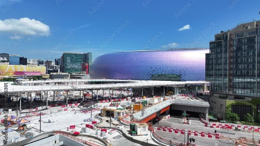 Aerial view of Kai Tak Sports Park construction in Hong Kong, showcasing CBD commercial buildings, urban residences, retail, leisure parks, and modern stadium sports and recreation facilities