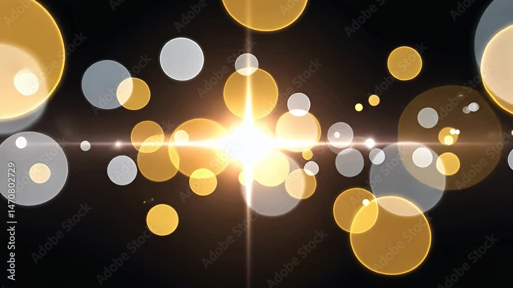 Abstract golden and silver bokeh lights against a dark background, creating a magical atmosphere.