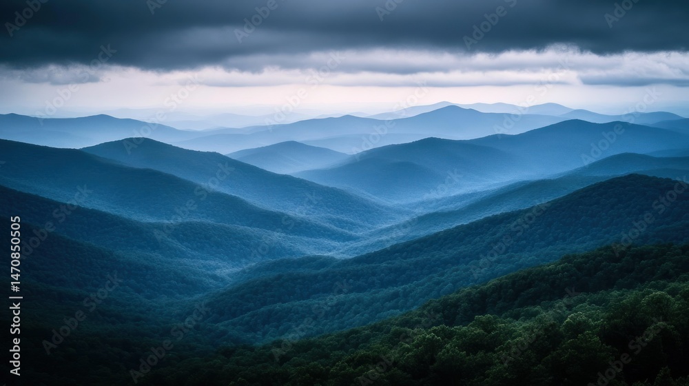 Obraz premium Serene mountain landscape captured with layers of undulating ridges and forests