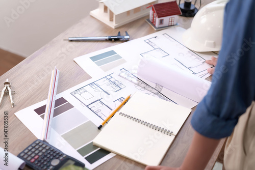 Architectural Design Blueprint on Desk with Tools and House Model for Interior Project Review Drafting Blueprint Design Idea Modern Studio