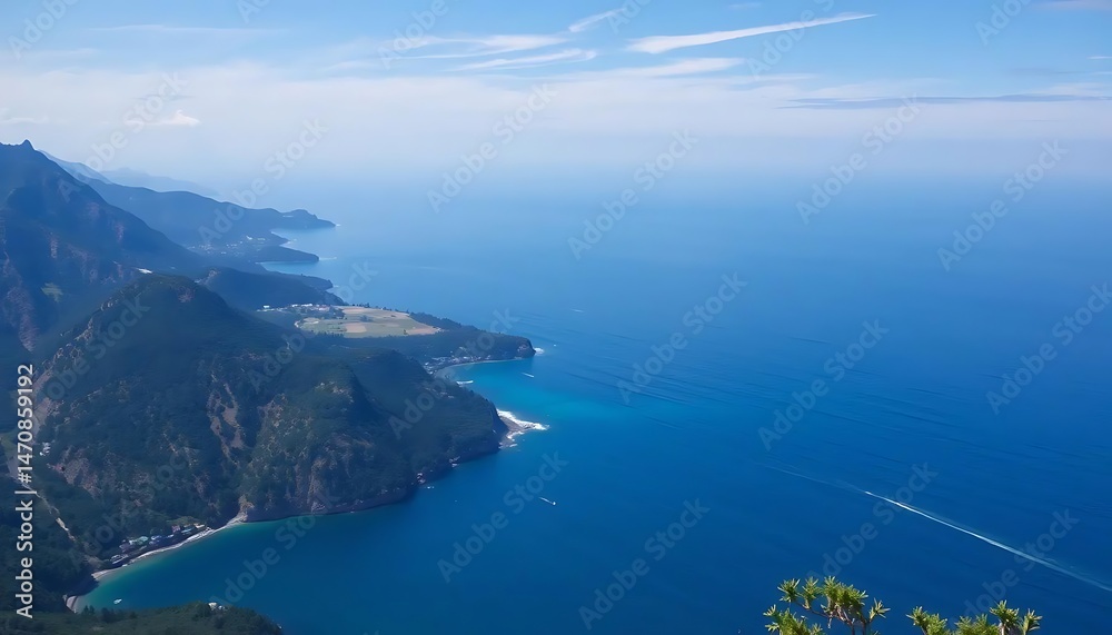 Panoramic coastal vista featuring mountains meeting vibrant blue ocean expanse Panoramic coastal vista featuring mountains meeting vibrant blue ocean expanse