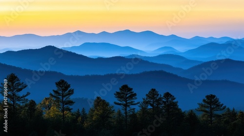 Layered Blue Mountains Appear Under a Colorful Dawn Sky