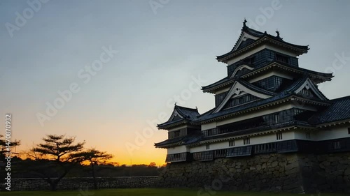 Traditional castle architecture at sunset with calm sky and scenic view