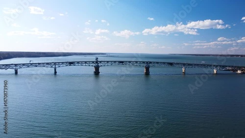 Wallpaper Mural Aerial view of the Coleman Memorial Bridge stretching across the York River into Yorktown, Virginia, on a clear, sunny afternoon with light traffic and calm waters. Torontodigital.ca