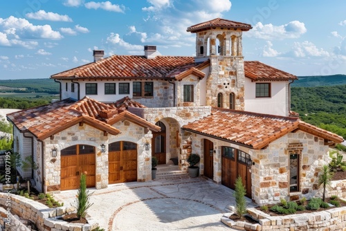 Elegant stone house with a charming landscape and blue sky backdrop.