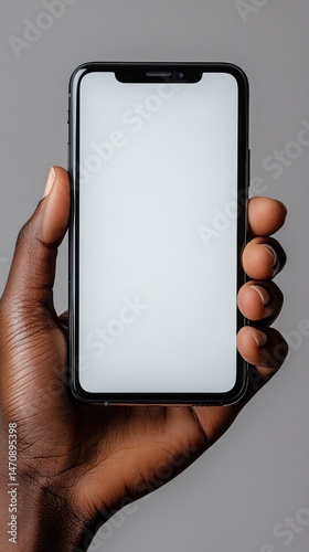 Smartphone held in hand, blank screen