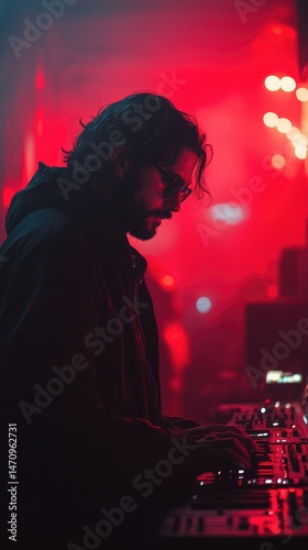Focused DJ in vibrant club setting